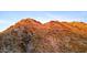 Striking close-up of a rugged mountain covered in sparse vegetation under a clear sky at 1836 E Turquoise Ave, Phoenix, AZ 85020