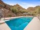 Inviting pool with diving board, mountain views, and covered seating area at 1836 E Turquoise Ave, Phoenix, AZ 85020