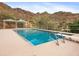 Beautiful pool area with diving board and lush mountain backdrop at 1836 E Turquoise Ave, Phoenix, AZ 85020