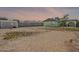 A large private backyard is ready for your personal touch and transformation with block fencing at 1838 E 2Nd Pl, Mesa, AZ 85203