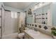 Full bathroom with subway tile, decorative tiles, and shower with a floral curtain at 1838 E 2Nd Pl, Mesa, AZ 85203