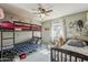 Shared bedroom with bunk beds, a single bed, and a window for natural light at 1838 E 2Nd Pl, Mesa, AZ 85203