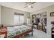 Bedroom featuring a large window, a closet, and a bed with a patterned quilt at 1838 E 2Nd Pl, Mesa, AZ 85203