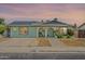 Charming single-story home featuring solar panels, an arched entryway and desert-friendly landscaping at 1838 E 2Nd Pl, Mesa, AZ 85203