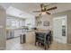 Bright kitchen featuring white cabinets, a stainless steel dishwasher, and tile flooring at 1838 E 2Nd Pl, Mesa, AZ 85203