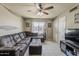 Cozy living room featuring a large sectional, window, and neutral decor at 1838 E 2Nd Pl, Mesa, AZ 85203