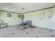 Enclosed patio with tiled floor and wicker furniture at 1838 E 2Nd Pl, Mesa, AZ 85203