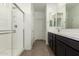 Bathroom featuring glass shower, vanity and tile floor at 18418 W Monte Lindo Ln, Surprise, AZ 85387