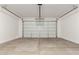 Spacious two car garage with sealed concrete floors at 18418 W Monte Lindo Ln, Surprise, AZ 85387