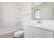 Clean bathroom with a shower-tub combination and white vanity with chrome faucet at 18456 W Monte Lindo Ln, Surprise, AZ 85387