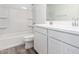 Bathroom with double vanity, soaking tub with shower, and tiled floor at 18456 W Monte Lindo Ln, Surprise, AZ 85387