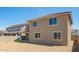 Charming two-story home featuring a gravel-covered backyard, covered patio, and a tile roof at 18456 W Monte Lindo Ln, Surprise, AZ 85387