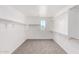 Spacious walk-in closet with carpet, ample storage and natural light at 18456 W Monte Lindo Ln, Surprise, AZ 85387