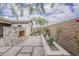 Beautiful backyard featuring stone fireplace, planters, desert landscaping, and paver patio at 18624 W Cathedral Rock Dr, Goodyear, AZ 85338