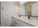 Bright bathroom featuring a double sink vanity with white quartz countertop, and matte black hardware at 18624 W Cathedral Rock Dr, Goodyear, AZ 85338