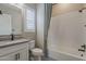 Bathroom featuring a shower-tub combo, patterned floor, and modern vanity at 18624 W Cathedral Rock Dr, Goodyear, AZ 85338