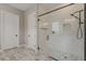 Bathroom showcasing a glass shower, white subway tile, and modern shower fixtures at 18624 W Cathedral Rock Dr, Goodyear, AZ 85338