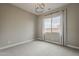 Neutral bedroom with plush carpet, designer curtains, and ample natural light at 18624 W Cathedral Rock Dr, Goodyear, AZ 85338