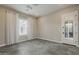 Light-filled bedroom with hexagon floors, bright walls, and a door to the outdoors at 18624 W Cathedral Rock Dr, Goodyear, AZ 85338