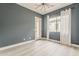 Serene bedroom featuring neutral walls, hardwood floors, and natural light at 18624 W Cathedral Rock Dr, Goodyear, AZ 85338