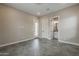Bedroom with hexagon tile flooring, a door to the patio, and a bathroom entrance at 18624 W Cathedral Rock Dr, Goodyear, AZ 85338