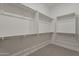 Walk-in closet offers ample storage with adjustable shelving and ample space at 18624 W Cathedral Rock Dr, Goodyear, AZ 85338