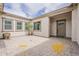 Charming courtyard features a beautiful potted plant and stone-paved ground at 18624 W Cathedral Rock Dr, Goodyear, AZ 85338