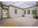Spacious courtyard with a potted plant and tiled ground surrounded by stucco walls at 18624 W Cathedral Rock Dr, Goodyear, AZ 85338