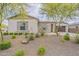 Charming single-story home with stone accents, lush desert landscaping, and a two car garage at 18624 W Cathedral Rock Dr, Goodyear, AZ 85338