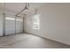 Spacious two car garage with an automatic door and a window at 18624 W Cathedral Rock Dr, Goodyear, AZ 85338