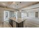 Open-concept kitchen with island, pendant lighting, and seamless access to dining area at 18624 W Cathedral Rock Dr, Goodyear, AZ 85338