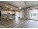 Bright, spacious kitchen features stainless steel appliances, white cabinetry, large island and sliding doors at 18624 W Cathedral Rock Dr, Goodyear, AZ 85338