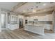 Modern kitchen with white cabinets, stainless steel appliances, and a large island at 18624 W Cathedral Rock Dr, Goodyear, AZ 85338