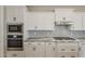 Well-equipped kitchen with stainless steel appliances and stylish backsplash at 18624 W Cathedral Rock Dr, Goodyear, AZ 85338