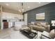 Cozy living room with built-in kitchenette, modern lighting, and elegant decor at 18624 W Cathedral Rock Dr, Goodyear, AZ 85338
