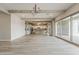 Spacious living room featuring an open layout with a beam and sliding doors at 18624 W Cathedral Rock Dr, Goodyear, AZ 85338
