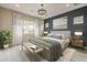 Comfortable main bedroom with stylish decor, soothing colors, and a large window at 18624 W Cathedral Rock Dr, Goodyear, AZ 85338