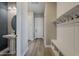 Mud room featuring a built-in bench with storage and coat hooks at 18624 W Cathedral Rock Dr, Goodyear, AZ 85338