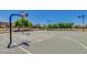Basketball court in community with nets, lighting, and mature trees at the community park at 1950 E Dust Devil Dr, San Tan Valley, AZ 85143