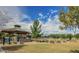 The community park offers a green space with a gazebo, pool, and inviting landscaping at 1950 E Dust Devil Dr, San Tan Valley, AZ 85143