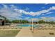 Large community pool surrounded by lounge chairs and a covered pavilion area for relaxing at 1950 E Dust Devil Dr, San Tan Valley, AZ 85143