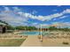 Large community pool surrounded by lounge chairs and a covered pavilion area for relaxing at 1950 E Dust Devil Dr, San Tan Valley, AZ 85143