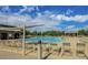Beautiful community pool area with lounge seating and shade structures for residents at 1950 E Dust Devil Dr, San Tan Valley, AZ 85143