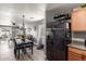 The open-concept dining area is furnished with a stylish table and seating for four at 1950 E Dust Devil Dr, San Tan Valley, AZ 85143