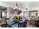 Inviting dining area featuring a chandelier and seamlessly connects to the living room at 1950 E Dust Devil Dr, San Tan Valley, AZ 85143