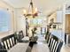 Inviting dining area connected to the kitchen, featuring stylish chandelier and dining set at 1950 E Dust Devil Dr, San Tan Valley, AZ 85143