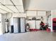 A well-organized garage featuring epoxy flooring, ample storage cabinets, and convenient access at 1950 E Dust Devil Dr, San Tan Valley, AZ 85143