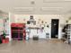 Garage featuring storage cabinets, tool chest, and epoxy flooring at 1950 E Dust Devil Dr, San Tan Valley, AZ 85143
