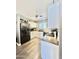 Bright kitchen boasts white cabinetry, stainless sink, modern appliances, and wood-look flooring at 1950 E Dust Devil Dr, San Tan Valley, AZ 85143
