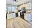 Well-lit kitchen with white cabinetry, modern appliances, and neutral countertops at 1950 E Dust Devil Dr, San Tan Valley, AZ 85143